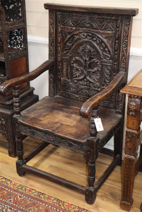 A pair of carved oak Wainscot chairs, W.60cm, D.60cm, H.110cm